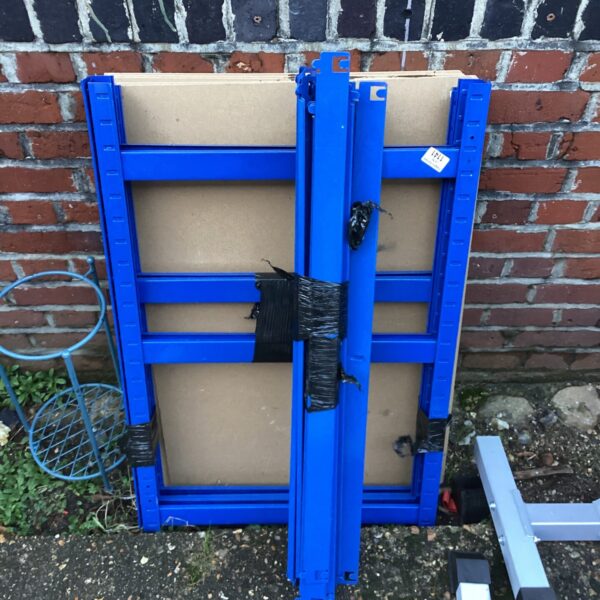 Blue metal racking unit with MDF shelves for storage.