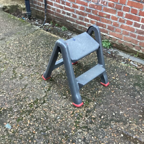 Plastic Curver step stool for household use.