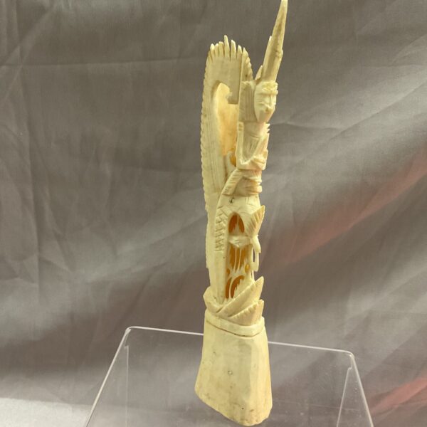 Detailed oriental bone carving with intricate Asian designs.