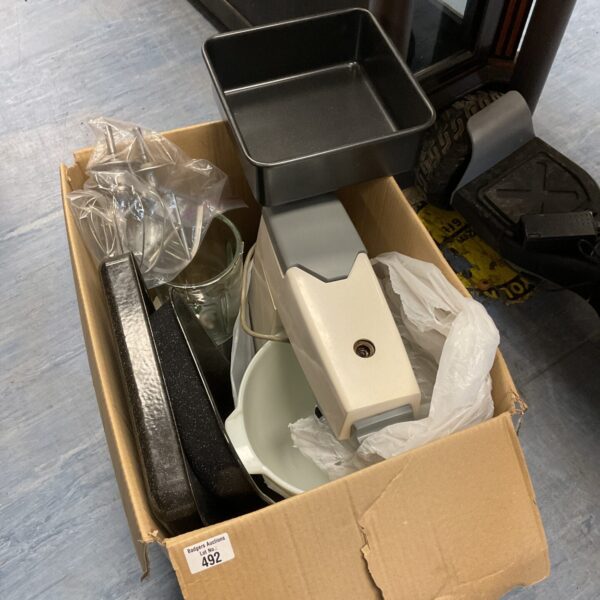 White kitchen mixer in cardboard box, vintage appliance.