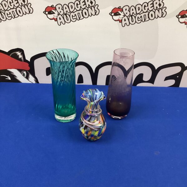 Vibrant blue handblown glass vase with swirling pattern.