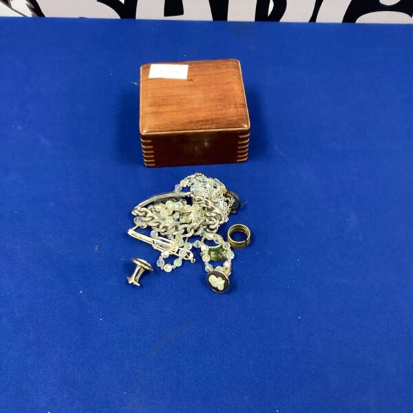 Vintage jewellery box with contents including an identity bracelet.