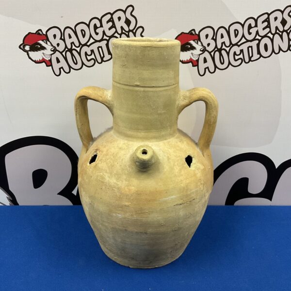Antique pottery water jug with a rustic, earthy tone.