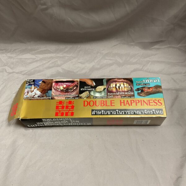 Vintage box of Double Happiness cigarettes with traditional Asian design.