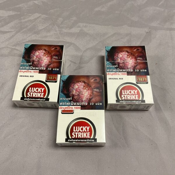 Vintage Lucky Strike cigarette packs in original condition.