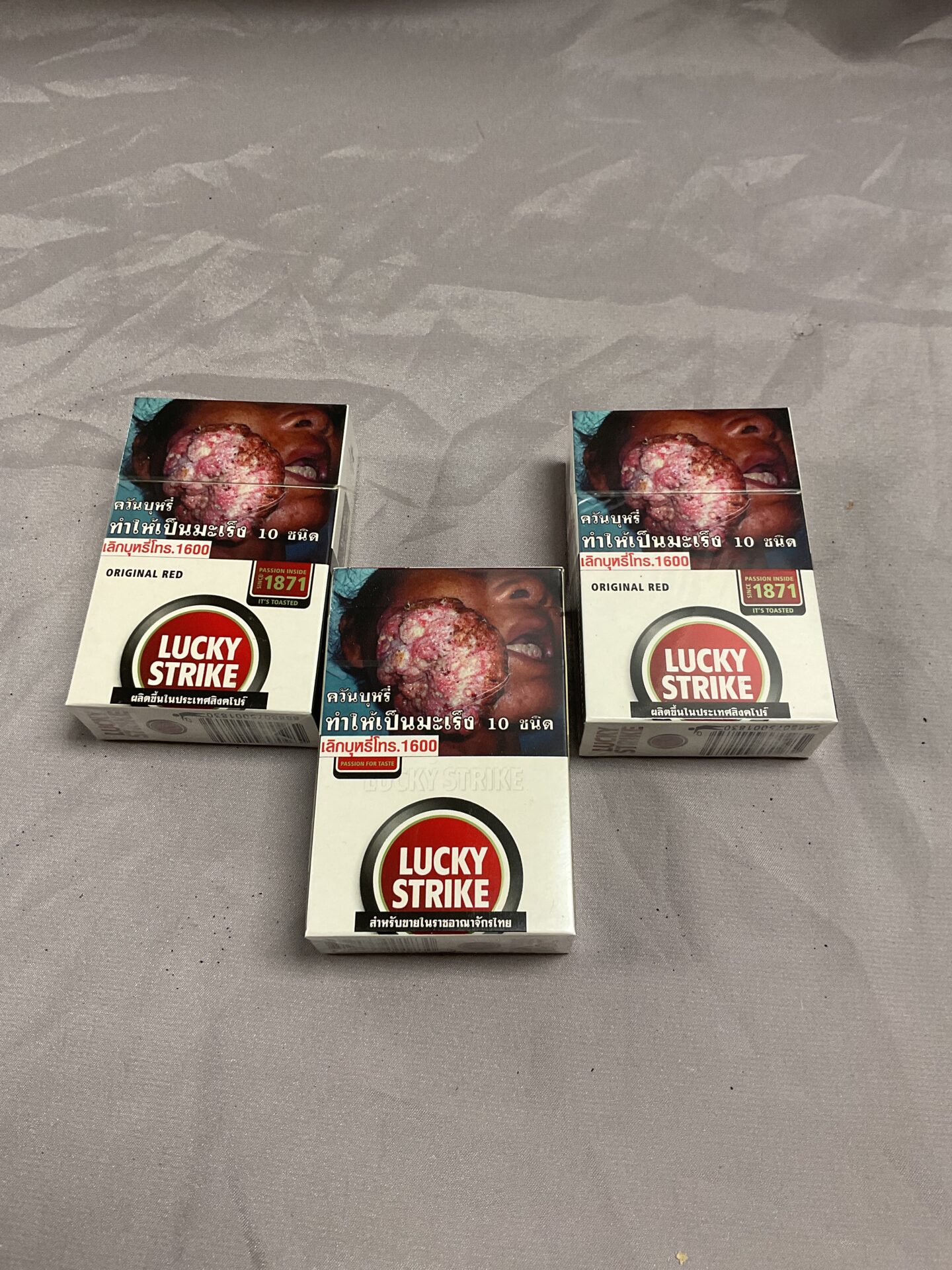 755 three packs of lucky strike cigarettes