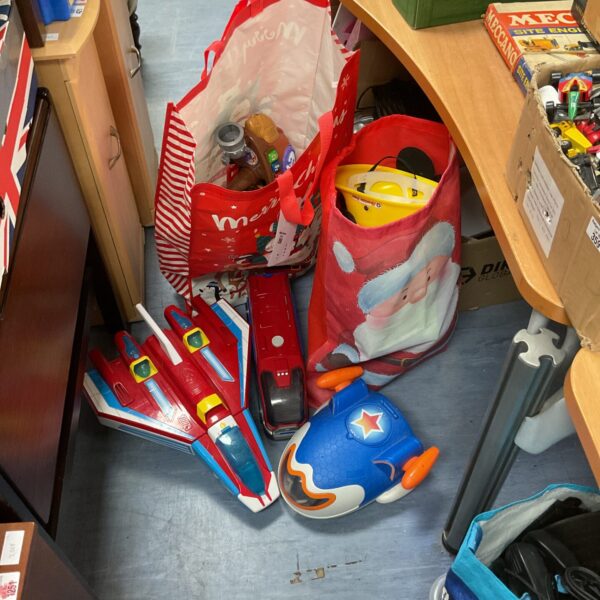 Mixed toy lot featuring Paw Patrol, Fireman Sam, and a spaceship.