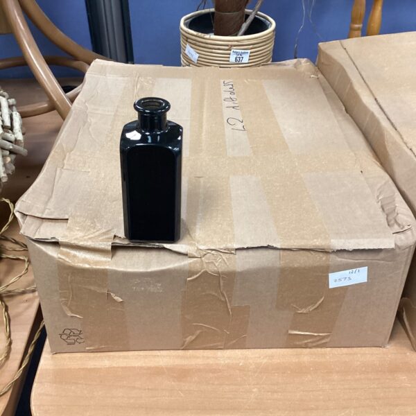 Lot of approximately 63 clear glass diffuser bottles for fragrance.
