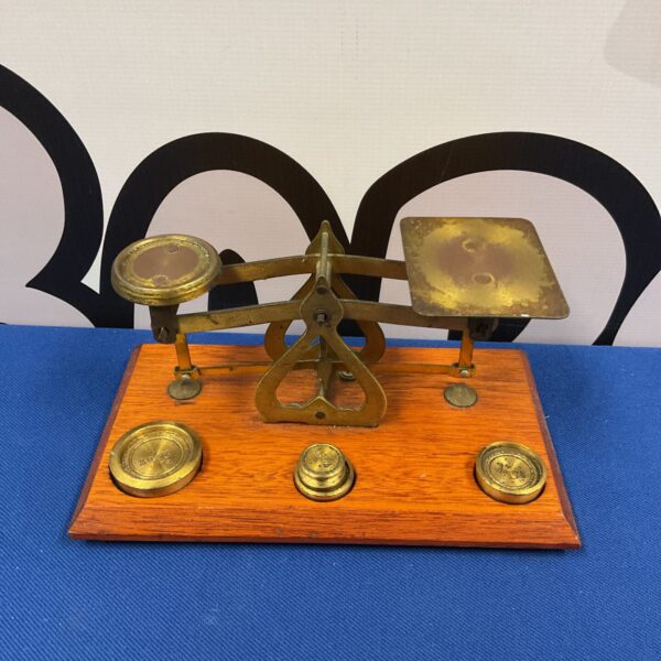 Vintage 1940s letter scales with weights for postal use.