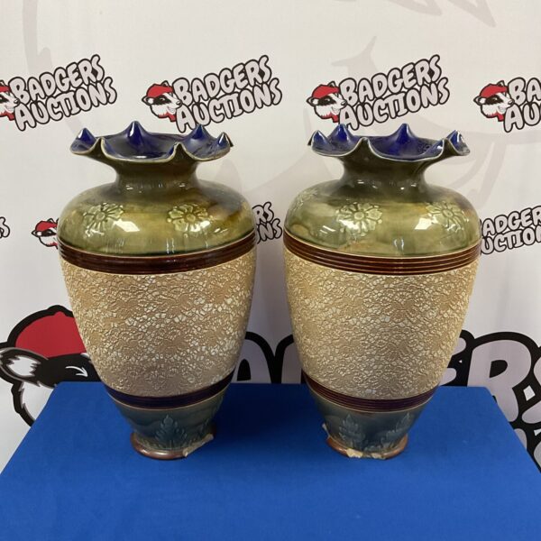 Pair of antique Doulton Lambeth vases with embossed design.