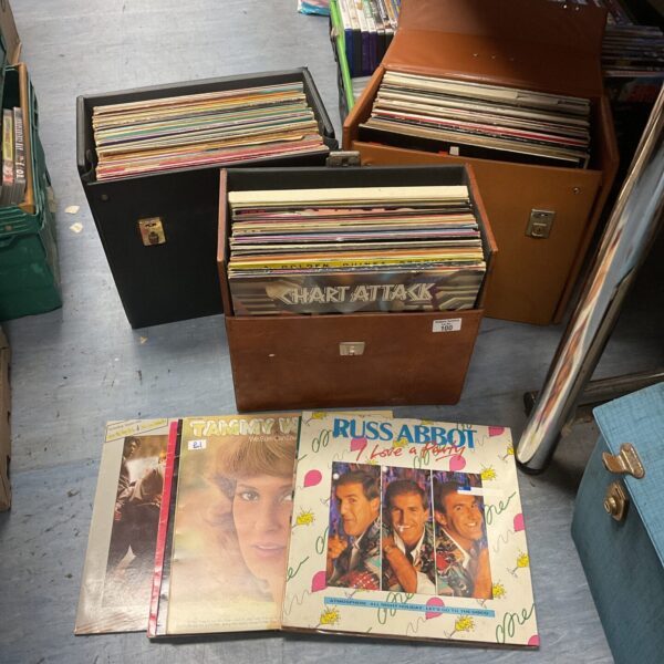 Vintage vinyl records lot in storage cases, a collector's assortment.