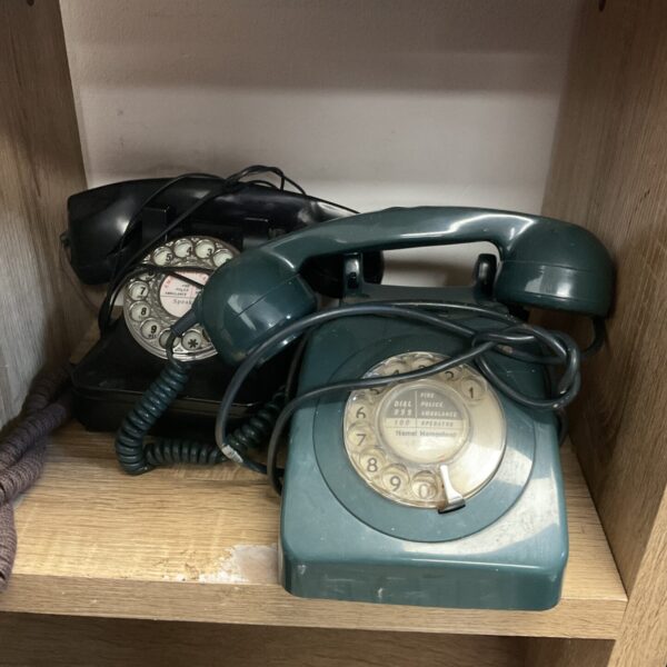 Pair of vintage rotary telephones, classic retro design.