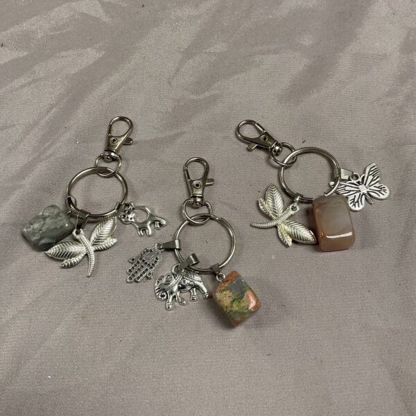 Vintage charm keyring lot with floral and grey stone.