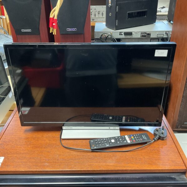 Toshiba 24" LCD TV with built-in DVD player, vintage electronics.