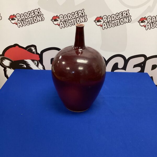 Decorative stone vase with a classic, rounded shape.