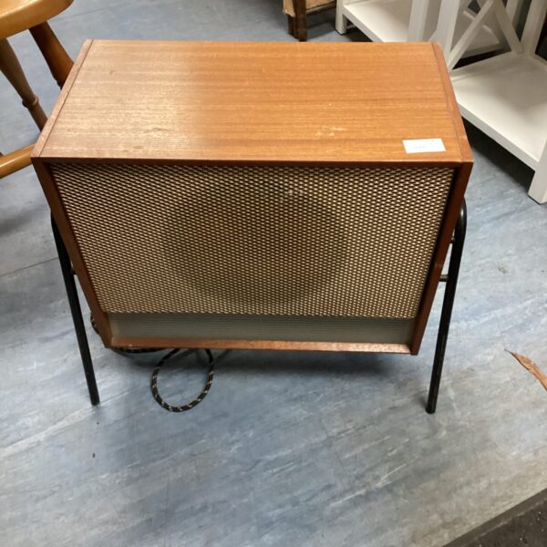 Vintage Remplay electric heater with wooden cabinet and black legs.