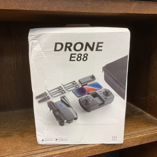 Compact Drone E88 quadcopter with remote control and camera.