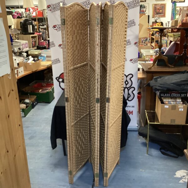 Vintage rattan room divider, a stylish boho home decor piece.
