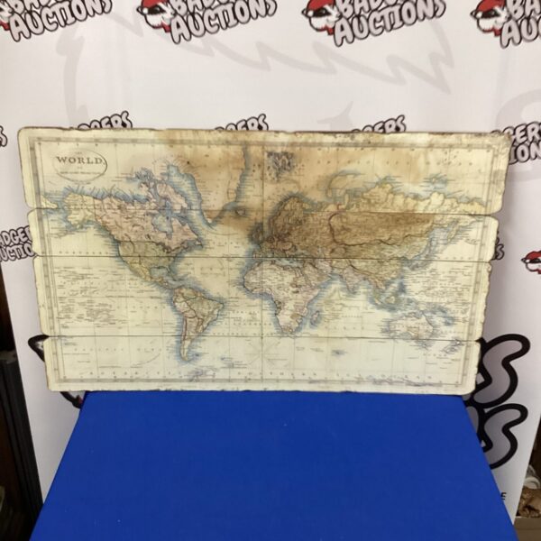 Detailed antique world map with faded colours and intricate borders.