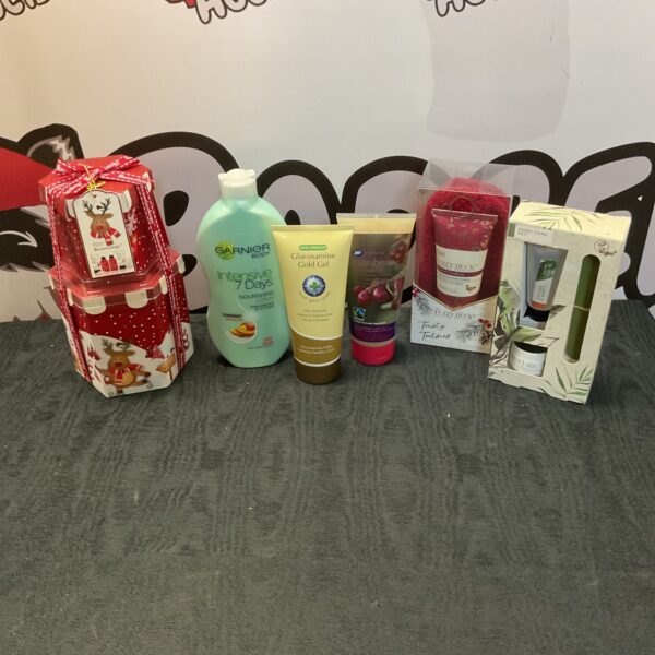 Colourful gift box containing a beauty product bundle with Garnier and Boots items.