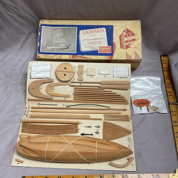 Vintage B-405 sampan model kit with wooden components.