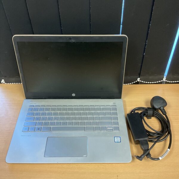Silver HP Pavilion laptop with charger, Intel Core i5 processor.