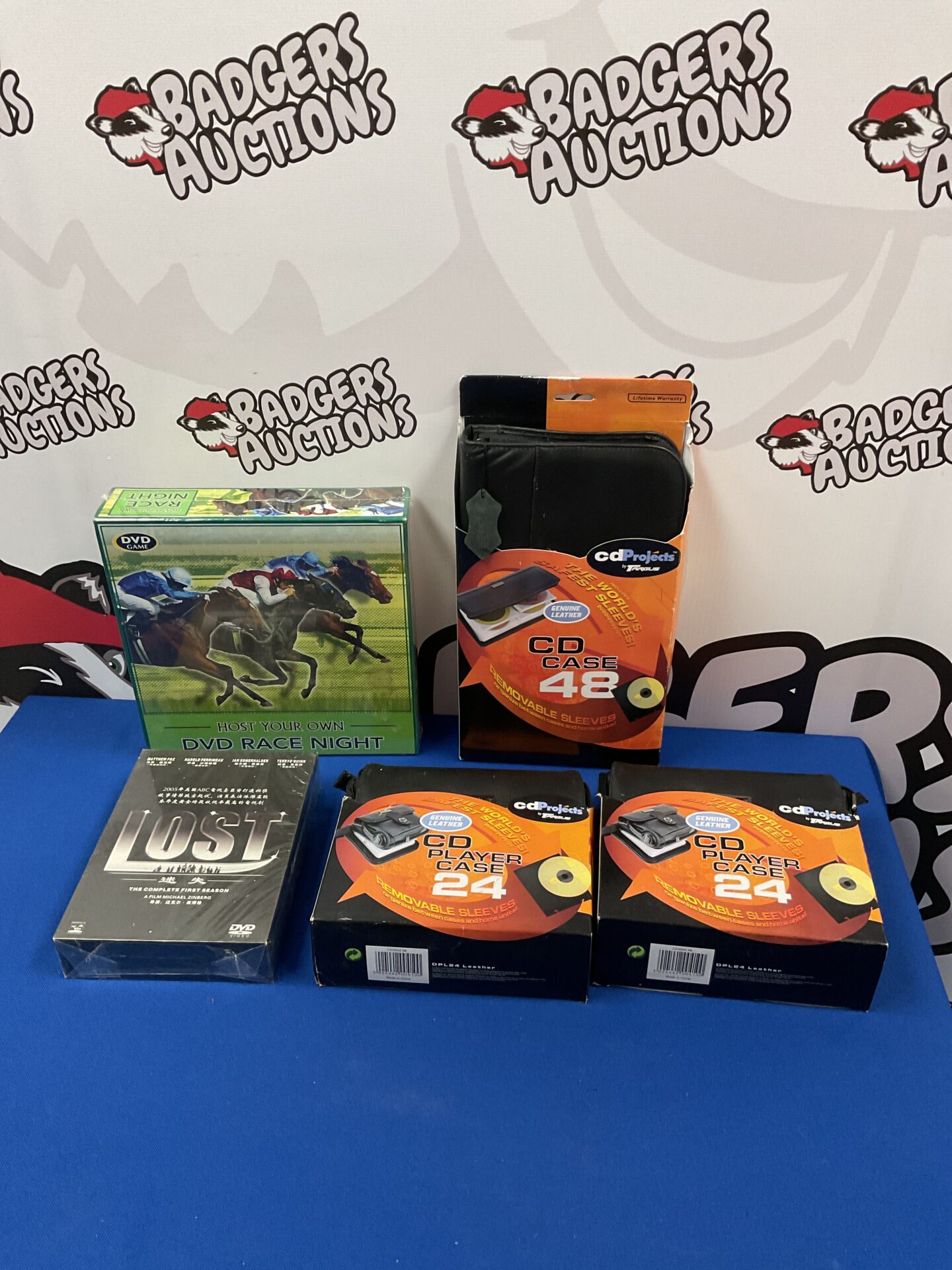 149 Three cd dvd wallets, new race night set & lost dvd boxset