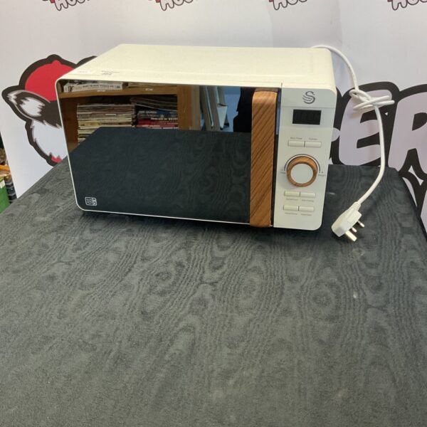 Cream retro Swan microwave, vintage kitchen appliance.