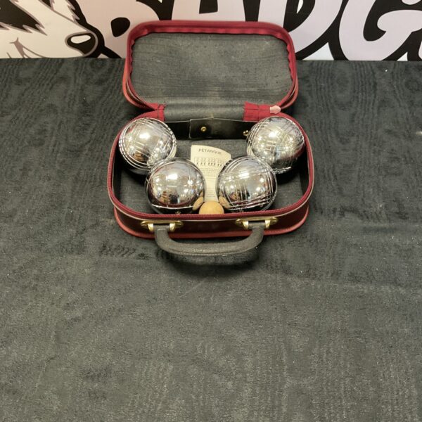 Vintage Obut boules set in red carrying case.