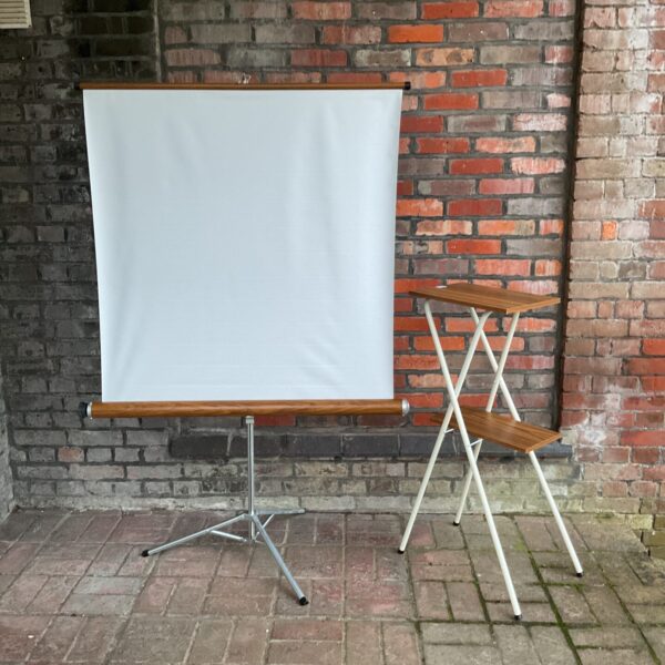 Folding projector screen and table set for presentations and movies.