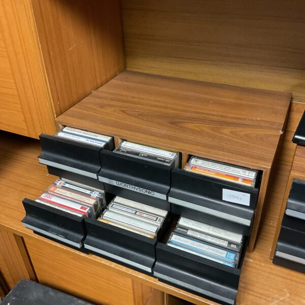Vintage Worthysonic cassette storage drawers filled with audio cassettes.