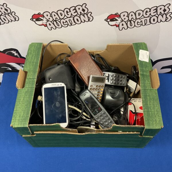 Mixed lot of used mobile phones and cables for repair or collection.