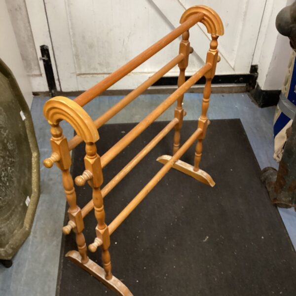 Vintage wooden clothes horse for drying laundry indoors.