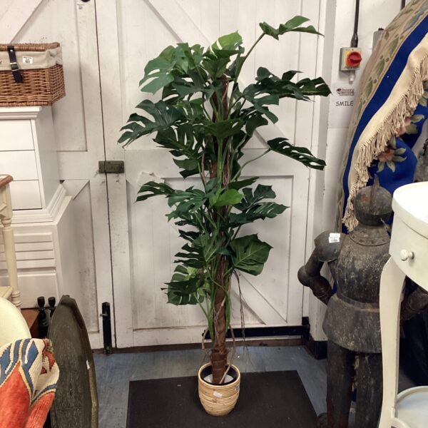Realistic artificial philodendron tree with large green leaves.