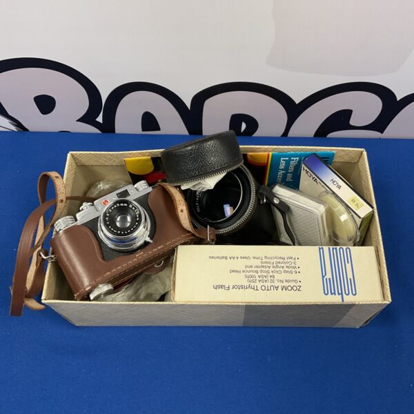 Vintage Halina Anastigmat camera with case and filters.