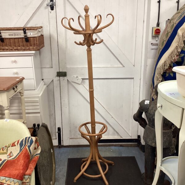 Vintage wooden coat stand with hat and stick holders.