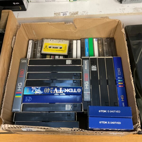 Mixed lot of vintage VHS and audio cassette tapes for collectors.
