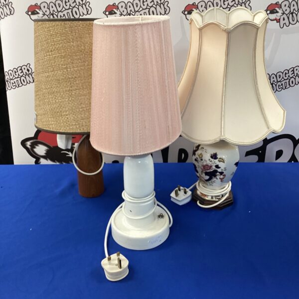 Vintage ceramic table lamp with floral design and cream shade.