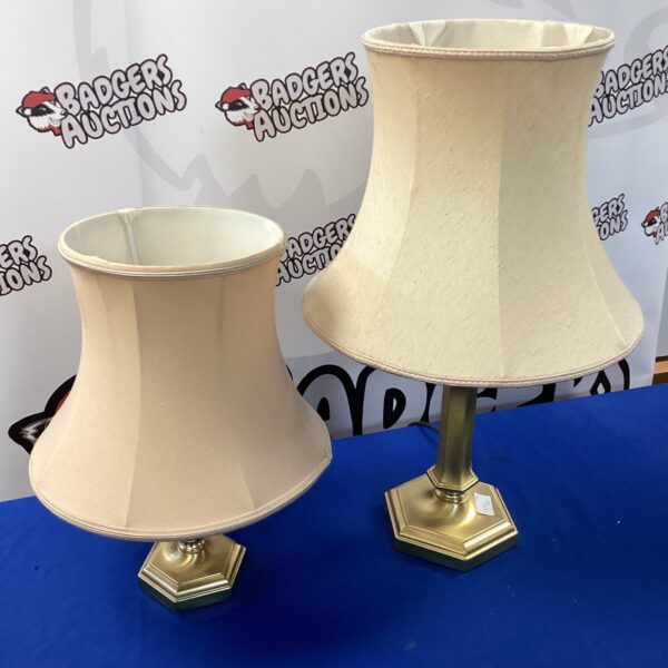 Pair of vintage brass table lamps with cream shades.