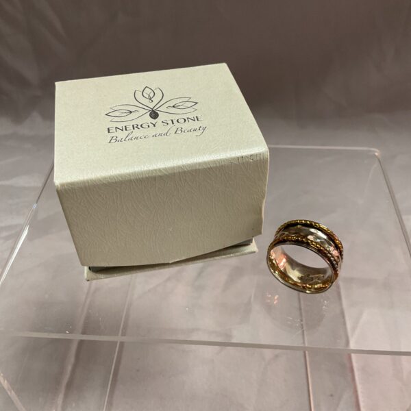 Sterling silver ring with copper spinners, size Q.
