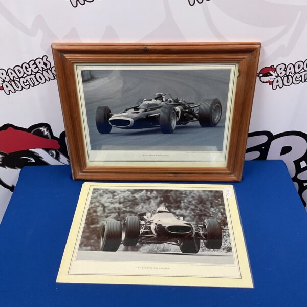 Classic Formula One racing print in a frame.