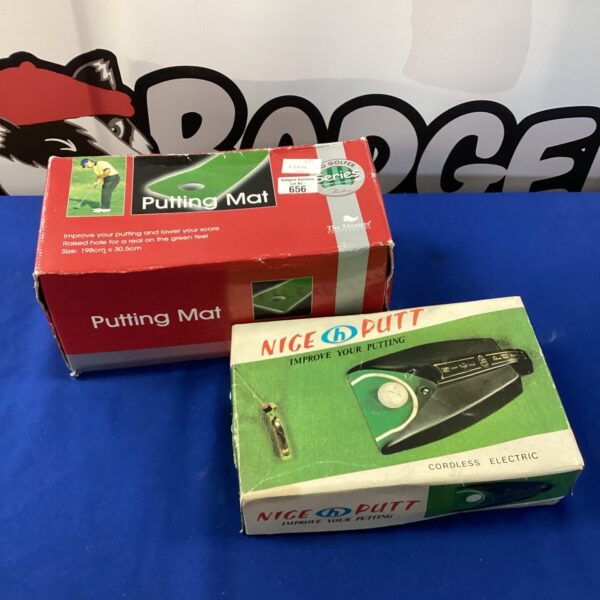 Golf putting mat with electric putting machine, model 656.