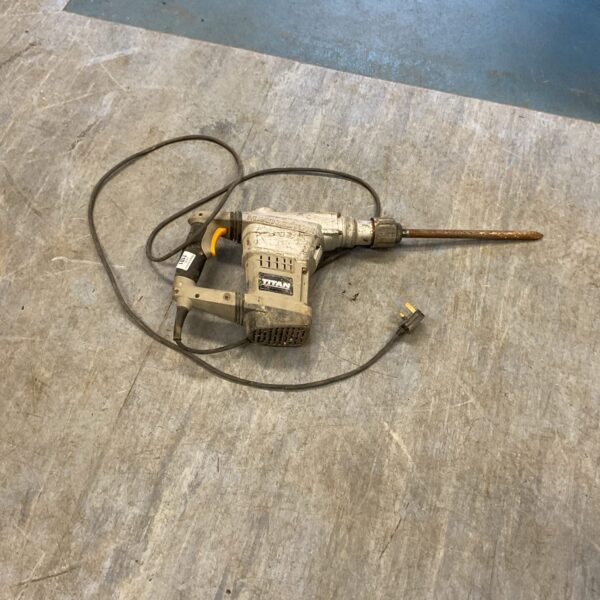 Vintage Titan electric drill, a classic power tool for collectors.