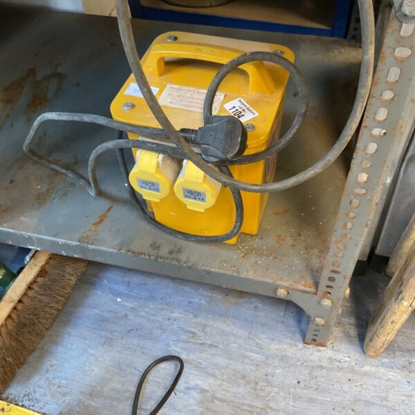 Yellow 110v transformer with single input/output connection.