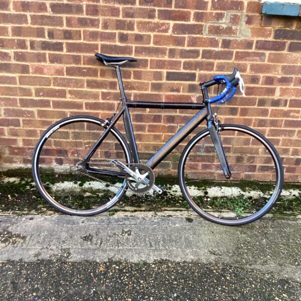 Sleek carbon fibre EC90 road bike for fast cycling.