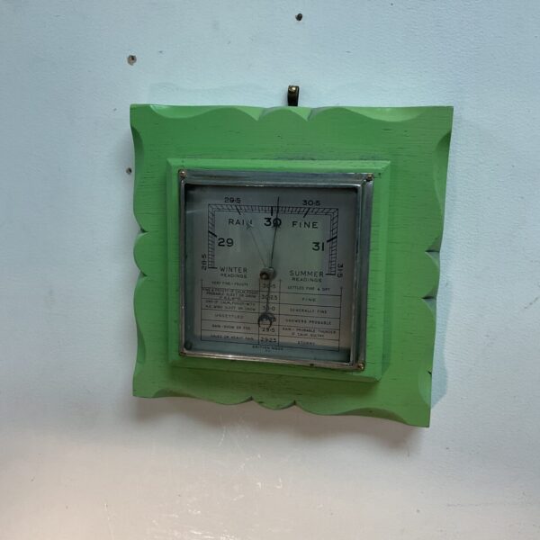 Vintage Art Deco O C wall barometer for weather monitoring.