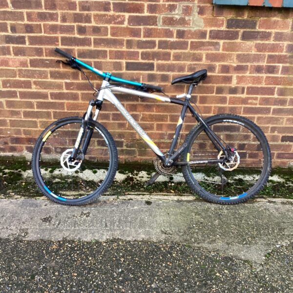 Grey and black Carrera Fury mountain bike for repair.