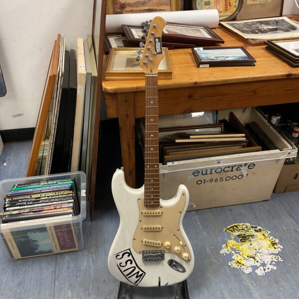 White Stagg electric guitar, a musical instrument for beginners.