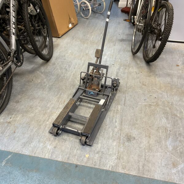 Vintage Switzer motorcycle jack stand for bike maintenance and repair.