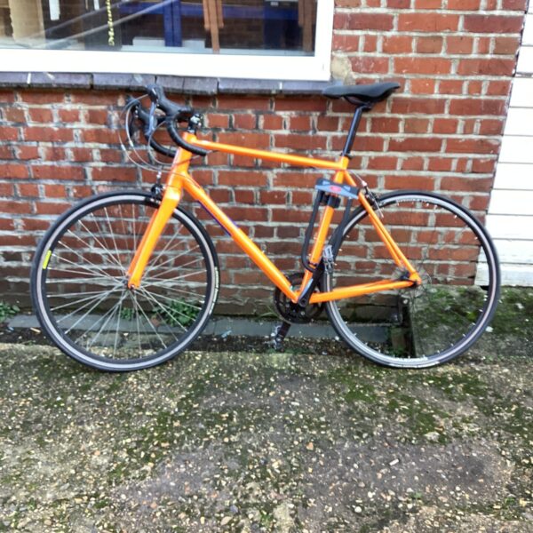 Orange Pinnacle Dolomite road bike for cycling.